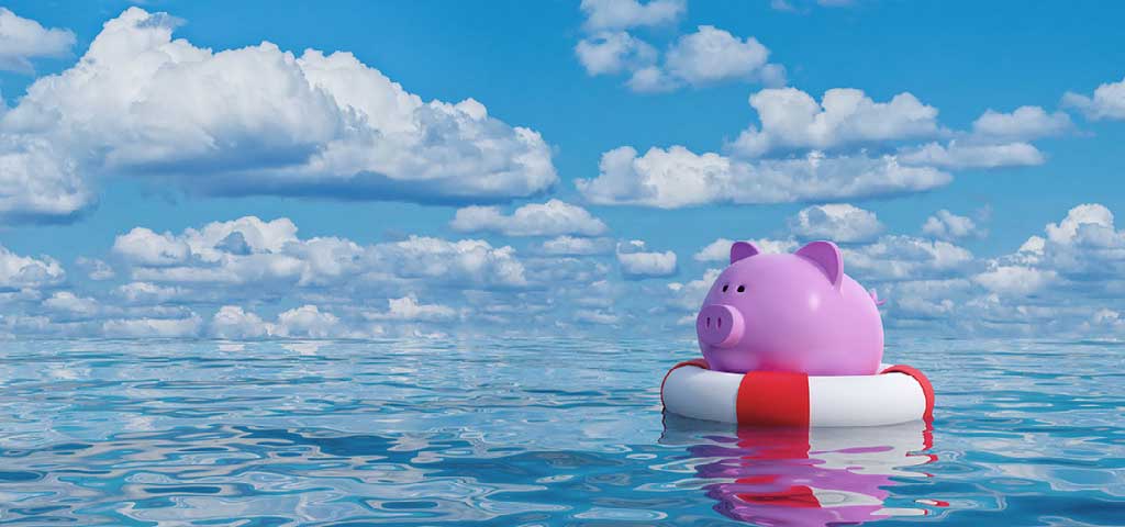 Piggy bank in a floaty in the water.